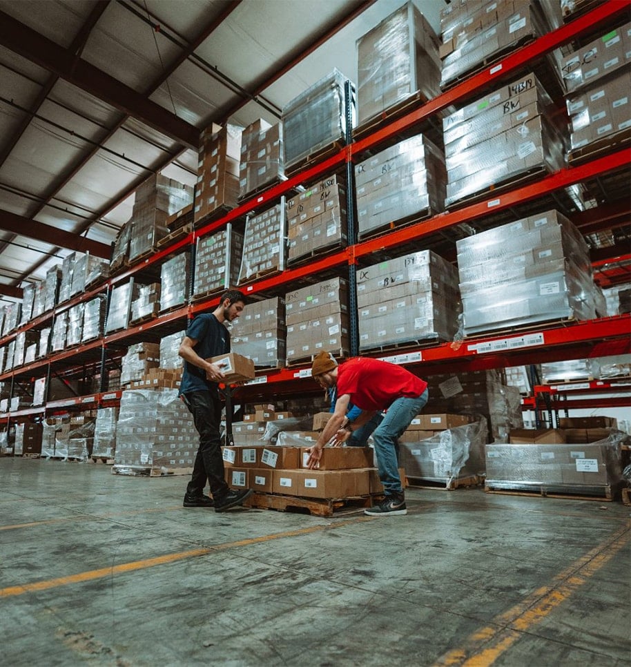 warehouse employees lifting packages